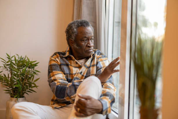 old man looking out window old man looking out window